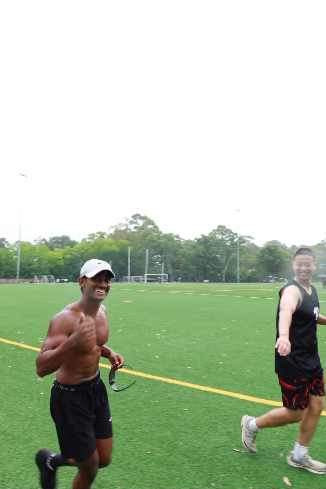 Runner smiling mid-lap