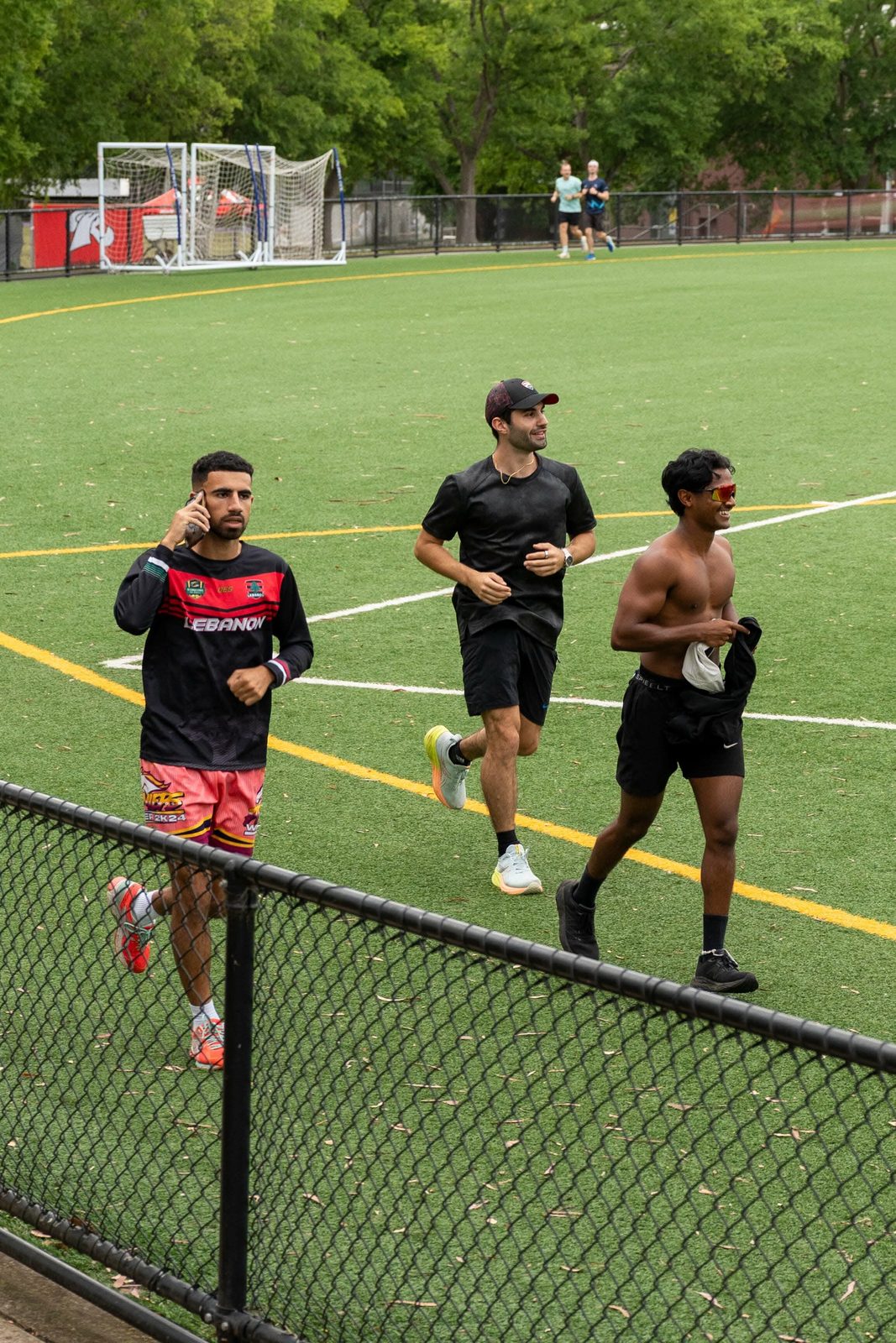 Three runners lapping the field