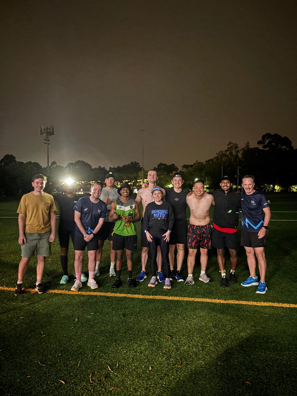 Runner under floodlights in the rain